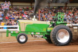 lime green tractor at tractor pulling event