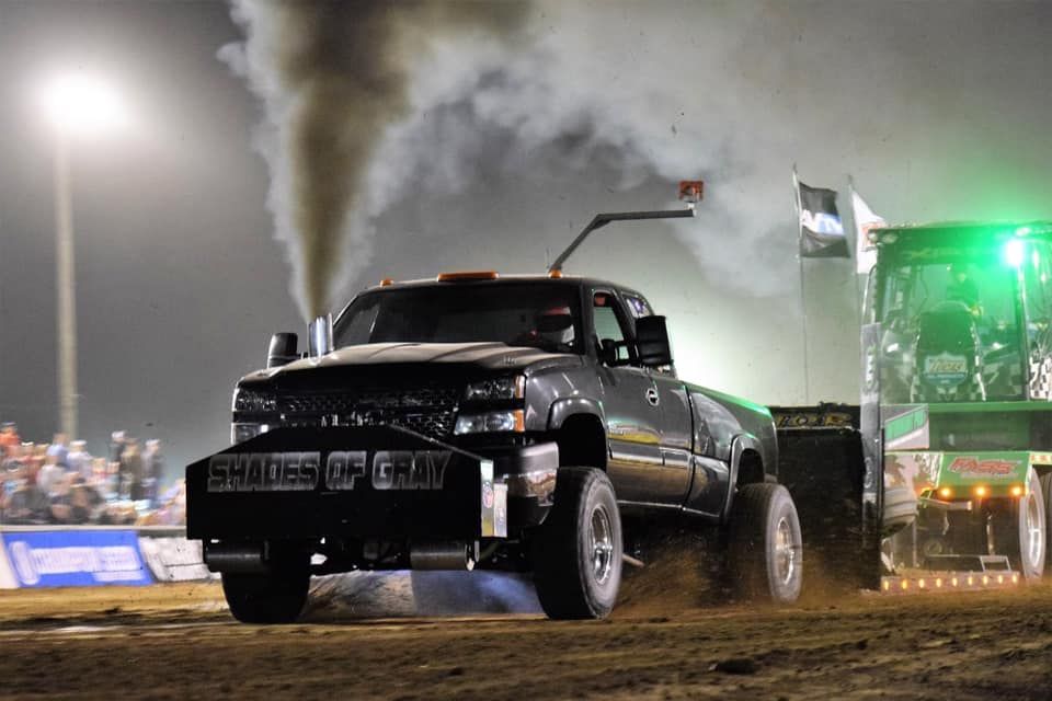 truck pulling at an outdoor truck pulling event truck pulling at an outdoor truck pulling event