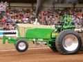 lime green tractor at tractor pulling event