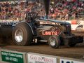 Beyond Limits tractor at a tractor pulling event outside in front of a crowd of people