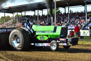 bright green tractor pulling outside