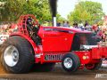 bright red tractor at tractor pulling event