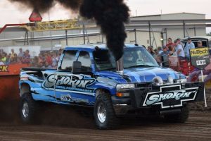 pulling truck blowing black smoke at truck pulling event pulling truck blowing black smoke at truck pulling event