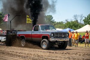 old pulling truck blowing smoke