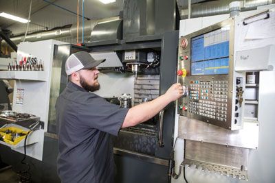 CNC Machinist Working on Diesel Performance Parts